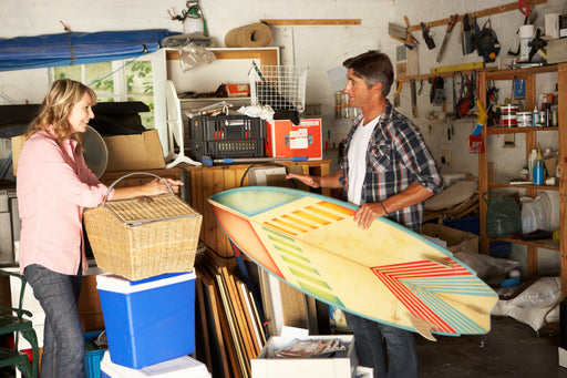 a couple clearing out their garage