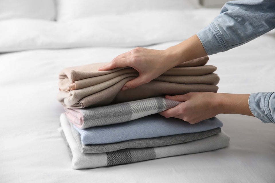 a pile of soft cashmere scarves