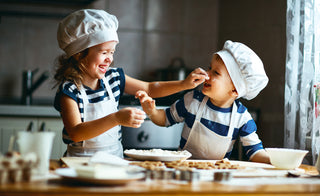children playing with flour while baking in the kitchen