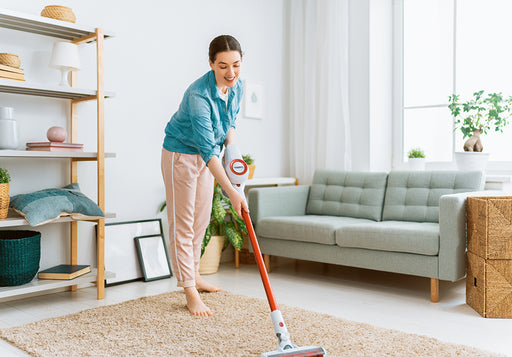 a woman vacuum cleaning her home