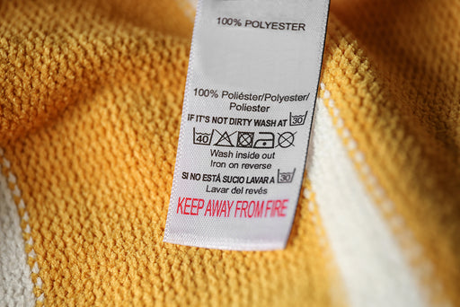 yellow polyester fabric with washing instructions
