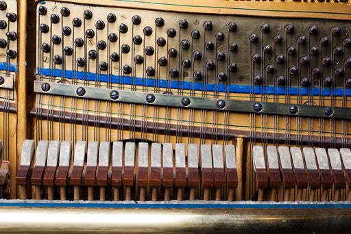 the interior of a piano with keys covered in felt