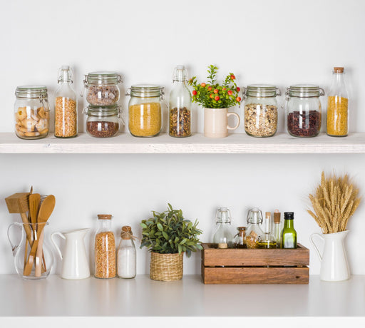 clean kitchen shelves with grains and cereals in sealed jars