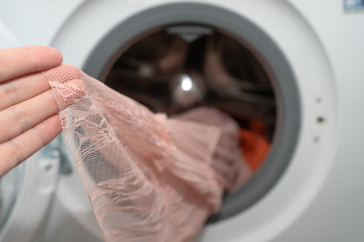 delicate pink lace coming out of the washing machine