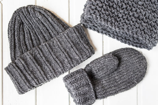 a gray woolen hat glove and scarf