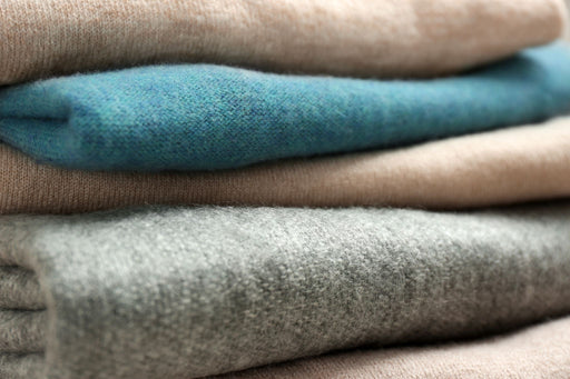 a folded pile of luxurious cashmere