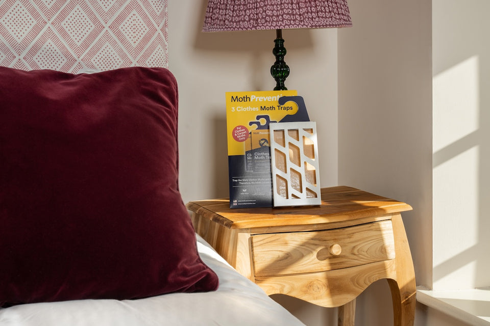 a MothPrevention Moth Trap on a bedside table