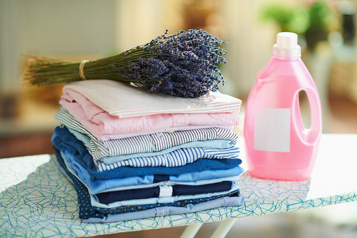 a freshly pressed pile of laundry with lavender sitting on top