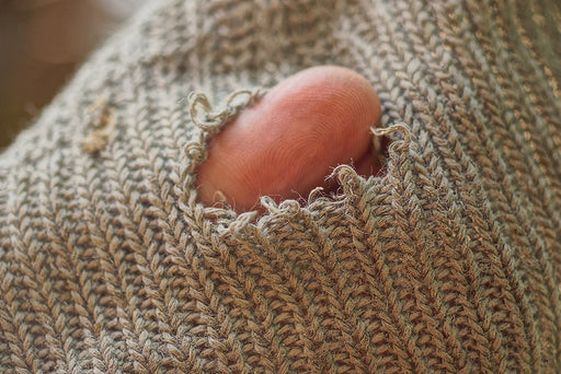 a hole in a knitted sweater