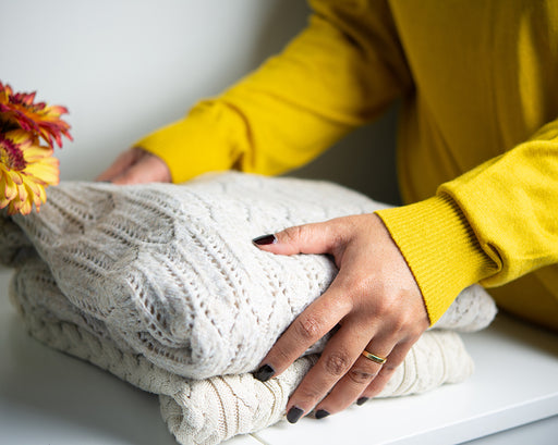 clean knitted woolens being placed on the side