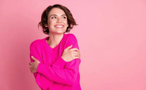 enjoying the feel of a quality sweater