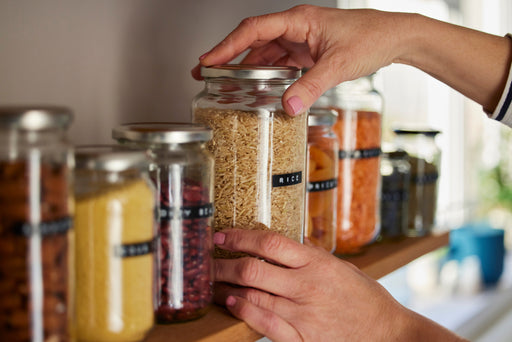 glass jars with screw top lids filled with pulses and grains