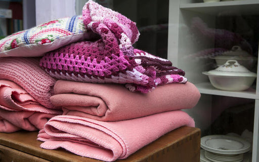 pile of pink wool blankets